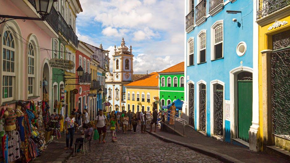 People Walking on Street Near Colorful Buildings